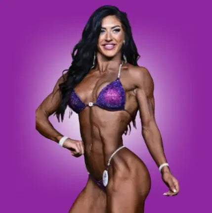 Annelle's Pro Card Nova, the epitome of elegance and strength for NPC Bikini or Wellness athletes. Designed with Annelle Petitpas, it showcases beautiful fuchsia and purple hues in unique designs. Elevate your stage presence with this striking suit, embodying confidence and style like never before.