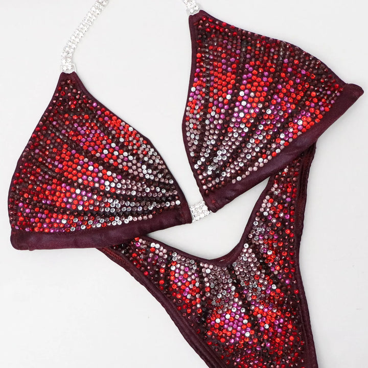 maroon competition suit for ocb fitness competitions that looks confident and beautiful on the npc stage and ifbb stage.