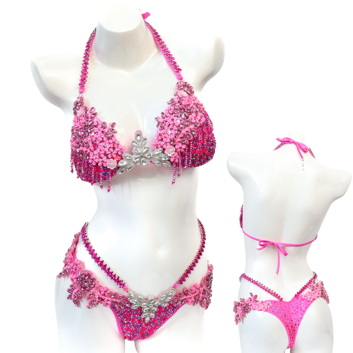 Pre Owned: Pink Fringe Couture. Medium Molded/Pro with Modest Rise.  Angel Competition BikinisThe best NPC Competition Suits for the Bikini Division, Fit Model Division Suits, and bodybuilding suits.
