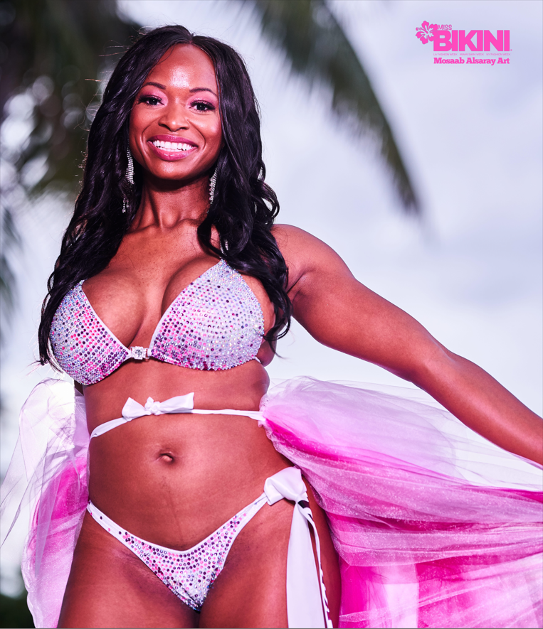 "Unleash your inner goddess with Na'yima's Goddess Trinity! ✨💖 This stunning hologram white bodybuilding suit adorned with pink and fuchsia crystals ensures you stand out on stage. Shine bright and embrace your divinity! #BodybuildingGoddess #GlamorousPerformance #Na'yimaDesigns"
