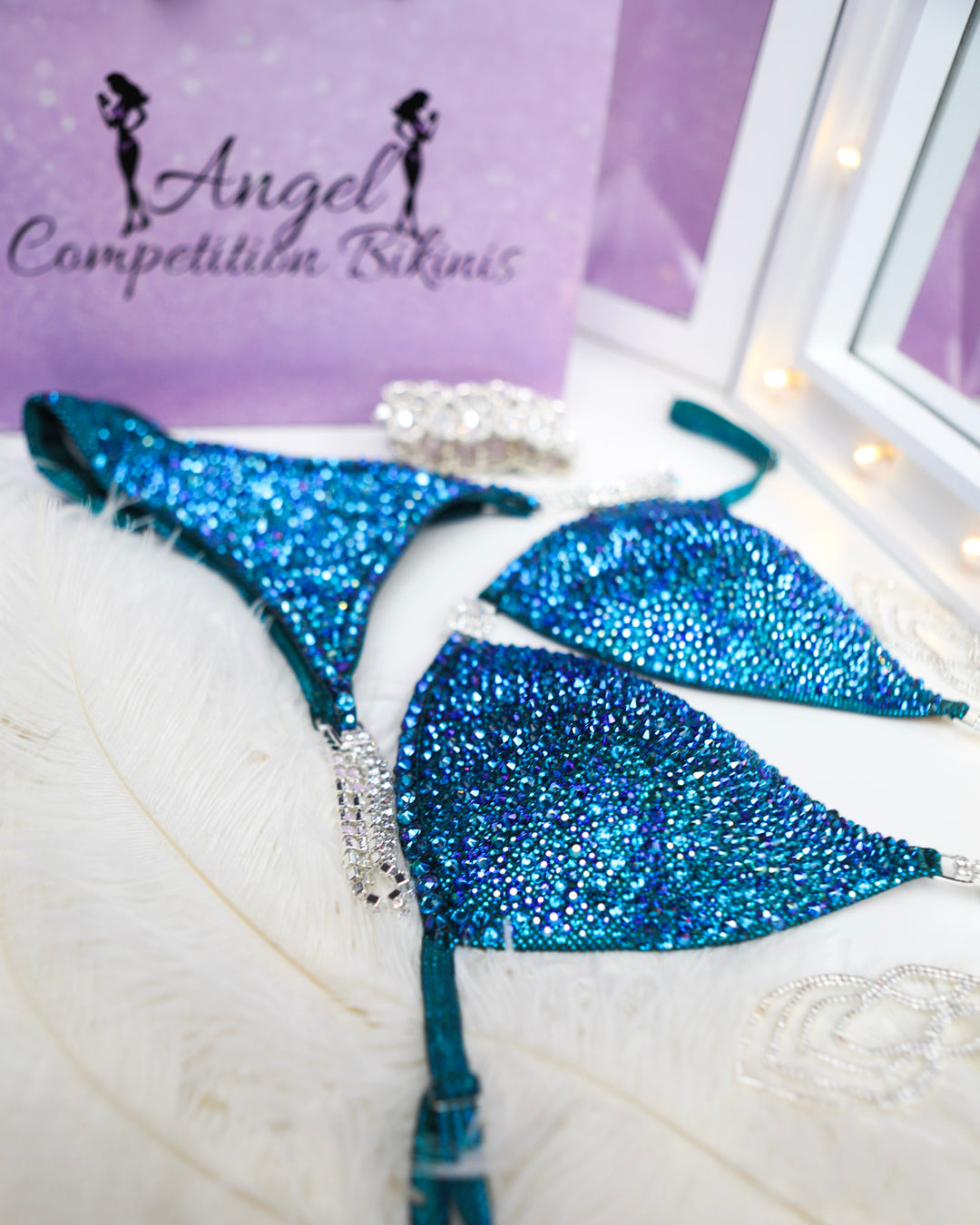 Introducing Jennifer's Teal Radiance competition suit! 💎 Sparkling teal adorned with confidence, designed to shine on stage like never before. Elevate your performance with Jennifer Capozzi's signature style! #ShineBright #ConfidenceBoost #StageGoddess 💪🌟