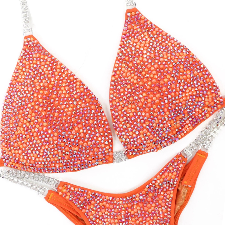 Julia’s Orange Glow Radiance  Angel Competition BikinisThe best NPC Competition Suits for the Bikini Division, Fit Model Division Suits, and bodybuilding suits.