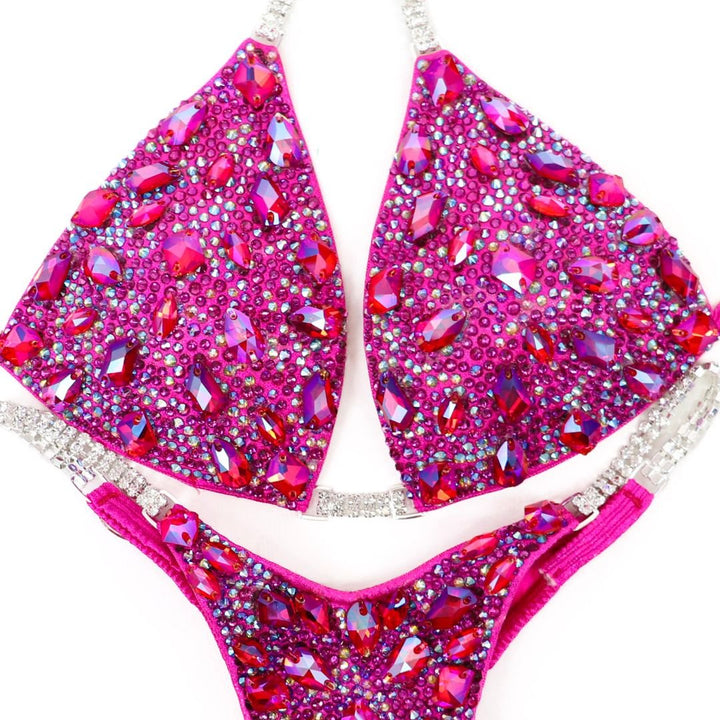 Pink Platinum Pro custom competition bikinis in pink for NPC bikini competition suit and figure competition suits