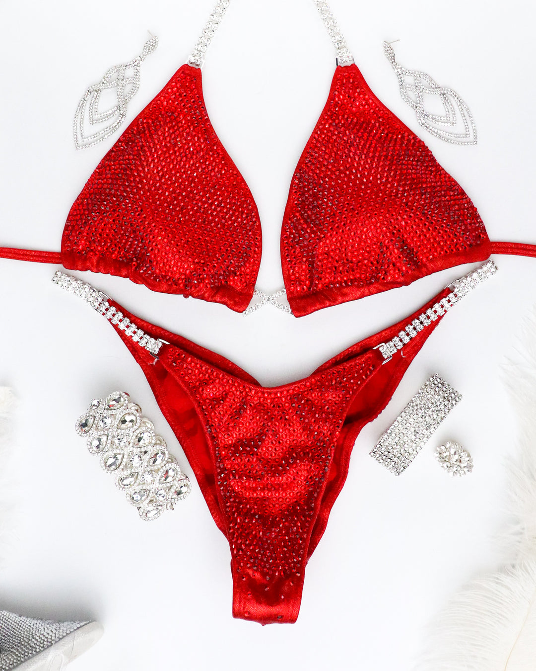 Unleash your power on stage with Red Radiance! 🔥 This striking red competition suit, adorned with dazzling Light Siam crystals, is a bold statement of strength and style. Stand out and own the spotlight! 💃 #RedRadiance #Bodybuilding #CompetitionReady 🏆