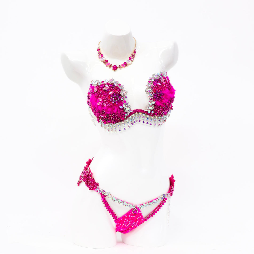 Pre Owned: Savana's Hot Pink Couture. Medium Molded/Pro with Modest Rise.  Angel Competition BikinisThe best NPC Competition Suits for the Bikini Division, Fit Model Division Suits, and bodybuilding suits.