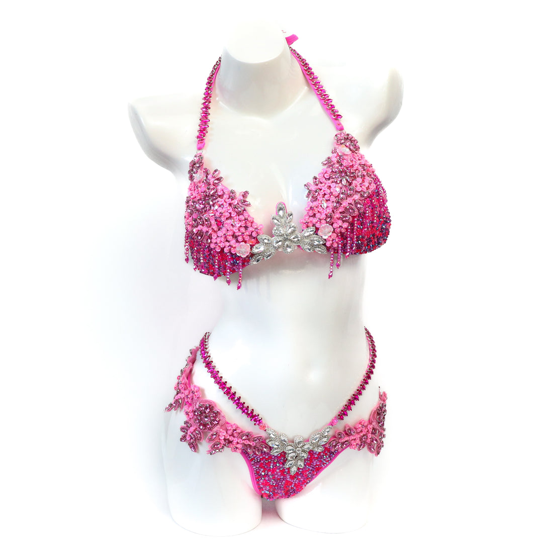 Pre Owned: Pink Fringe Couture. Medium Molded/Pro with Modest Rise.  Angel Competition BikinisThe best NPC Competition Suits for the Bikini Division, Fit Model Division Suits, and bodybuilding suits.
