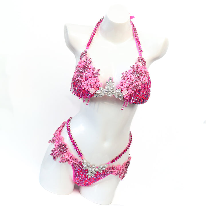 Pre Owned: Pink Fringe Couture. Medium Molded/Pro with Modest Rise.  Angel Competition BikinisThe best NPC Competition Suits for the Bikini Division, Fit Model Division Suits, and bodybuilding suits.