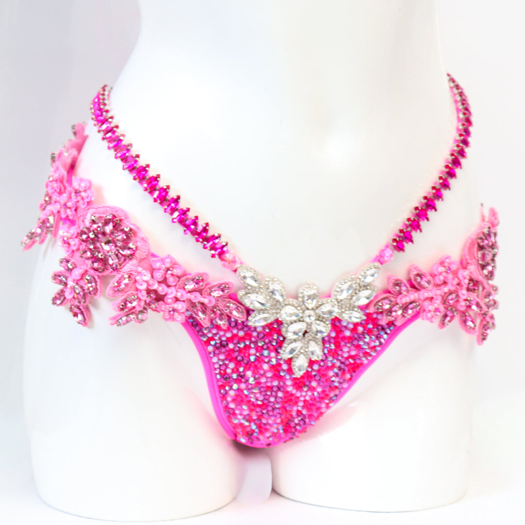 Pre Owned: Pink Fringe Couture. Medium Molded/Pro with Modest Rise.  Angel Competition BikinisThe best NPC Competition Suits for the Bikini Division, Fit Model Division Suits, and bodybuilding suits.