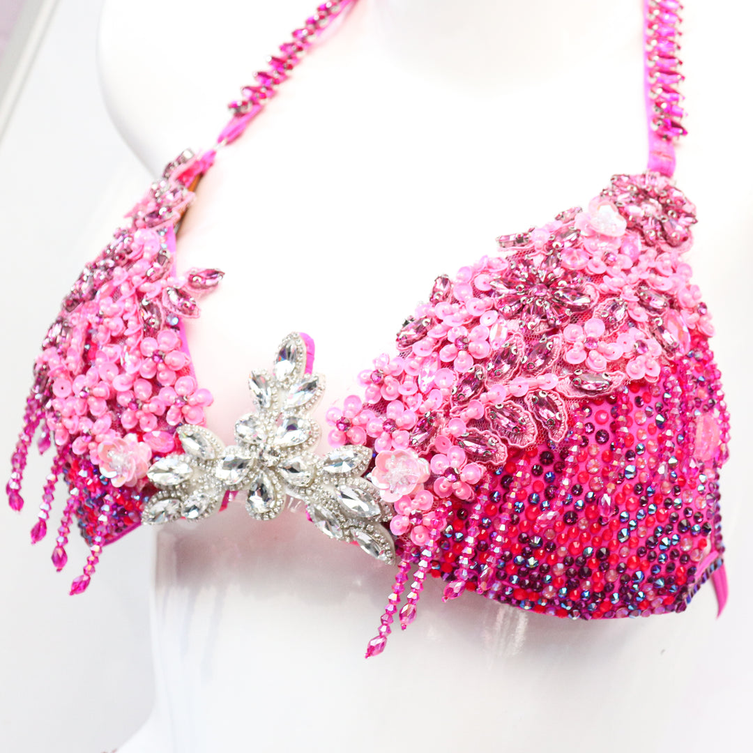 Pre Owned: Pink Fringe Couture. Medium Molded/Pro with Modest Rise.  Angel Competition BikinisThe best NPC Competition Suits for the Bikini Division, Fit Model Division Suits, and bodybuilding suits.