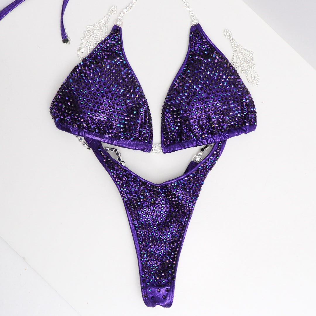 Introducing the Victorious Violet Diamond Pro: an Hologram Eggplant competition suit adorned with Chrome Purple AB and Violet crystals! 💎💜 Stand out on stage with its shimmering elegance and powerful presence. Perfect for those who want to showcase their strength and style! #BodybuildingSuit #CompetitionReady #VictoriousVioletDiamondPro