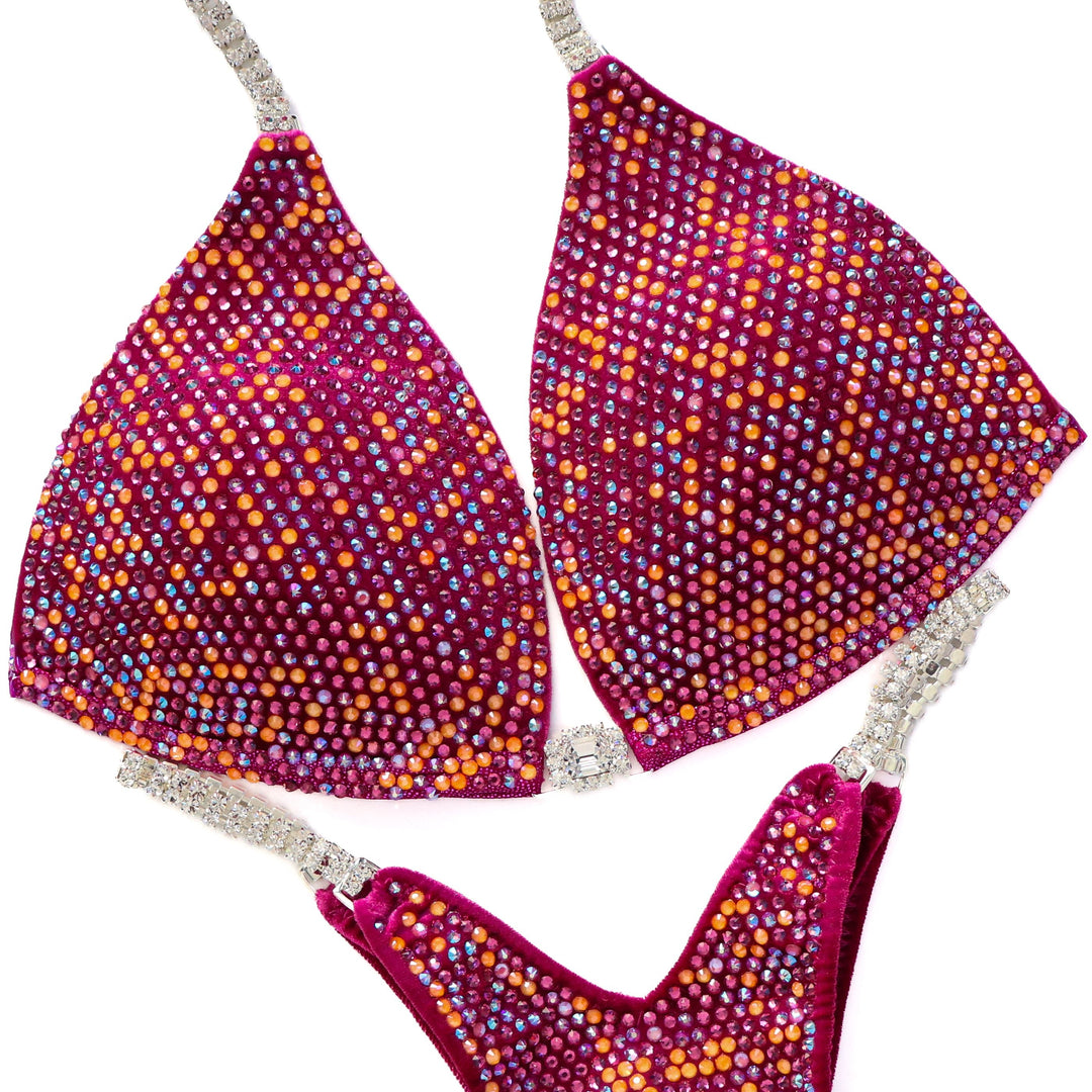 Close-up of Custom Angel Pro Multi Color bikini suit with multicolored 4mm crystals on purple fabric and rhinestone straps