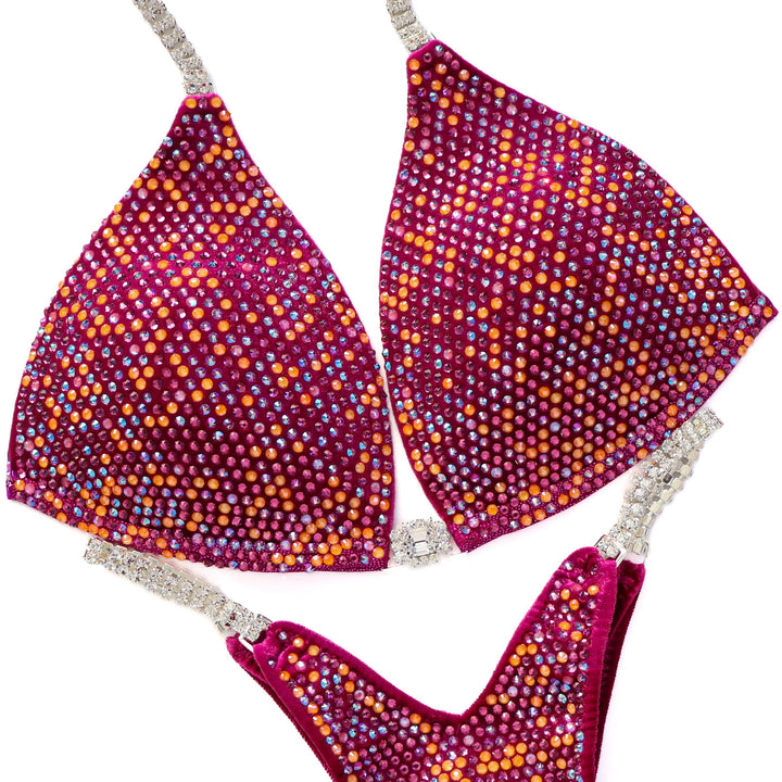 Close-up of Custom Angel Pro Multi Color bikini suit with multicolored 4mm crystals on purple fabric and rhinestone straps