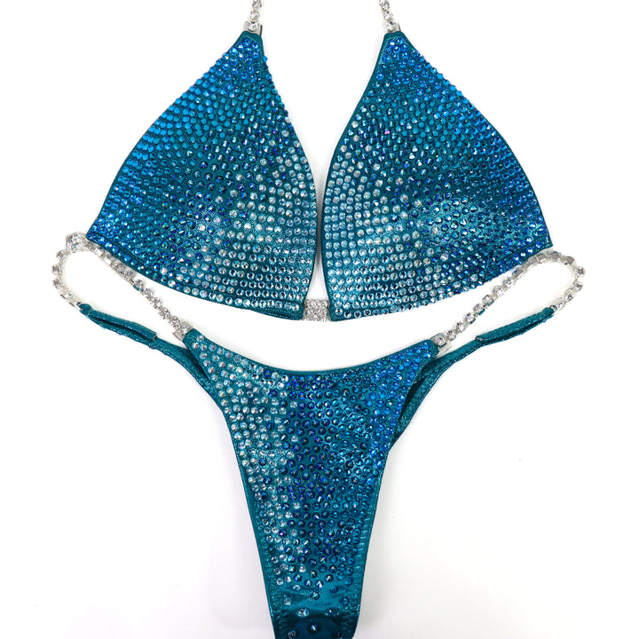 QS ST: Capri Cascade Glow. Hologram Teal. Medium Molded/Pro.  Angel Competition BikinisThe best NPC Competition Suits for the Bikini Division, Fit Model Division Suits, and bodybuilding suits.
