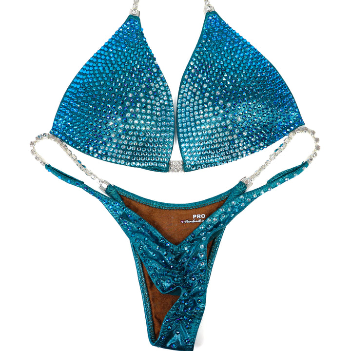 QS ST: Capri Cascade Glow. Hologram Teal. Medium Molded/Pro.  Angel Competition BikinisThe best NPC Competition Suits for the Bikini Division, Fit Model Division Suits, and bodybuilding suits.