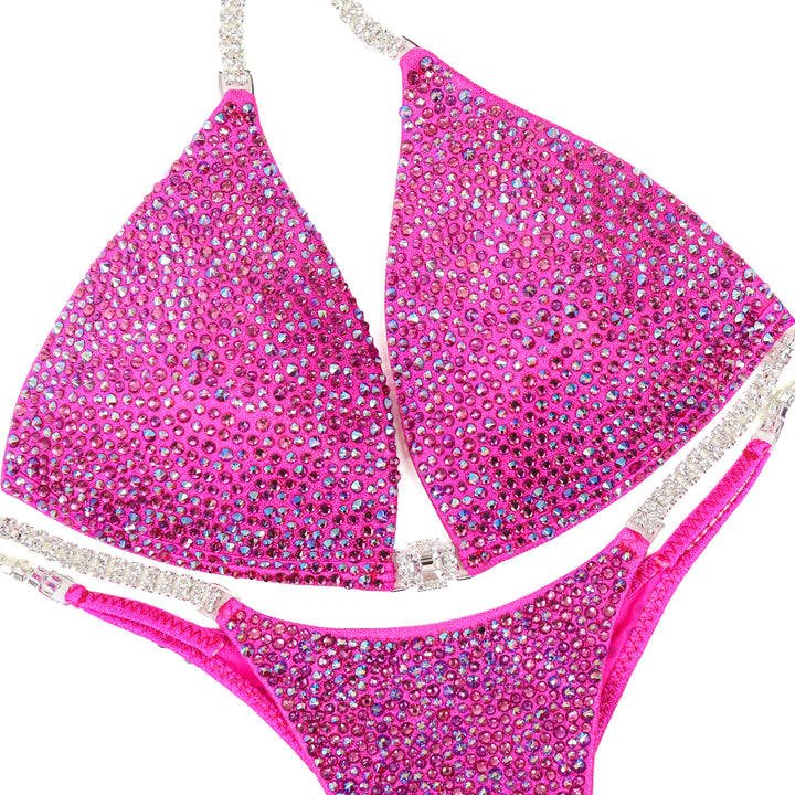 QS ST: Lucia's Pink Radiance. Hologram Pink. Medium Molded/Pro.  Angel Competition BikinisThe best NPC Competition Suits for the Bikini Division, Fit Model Division Suits, and bodybuilding suits.