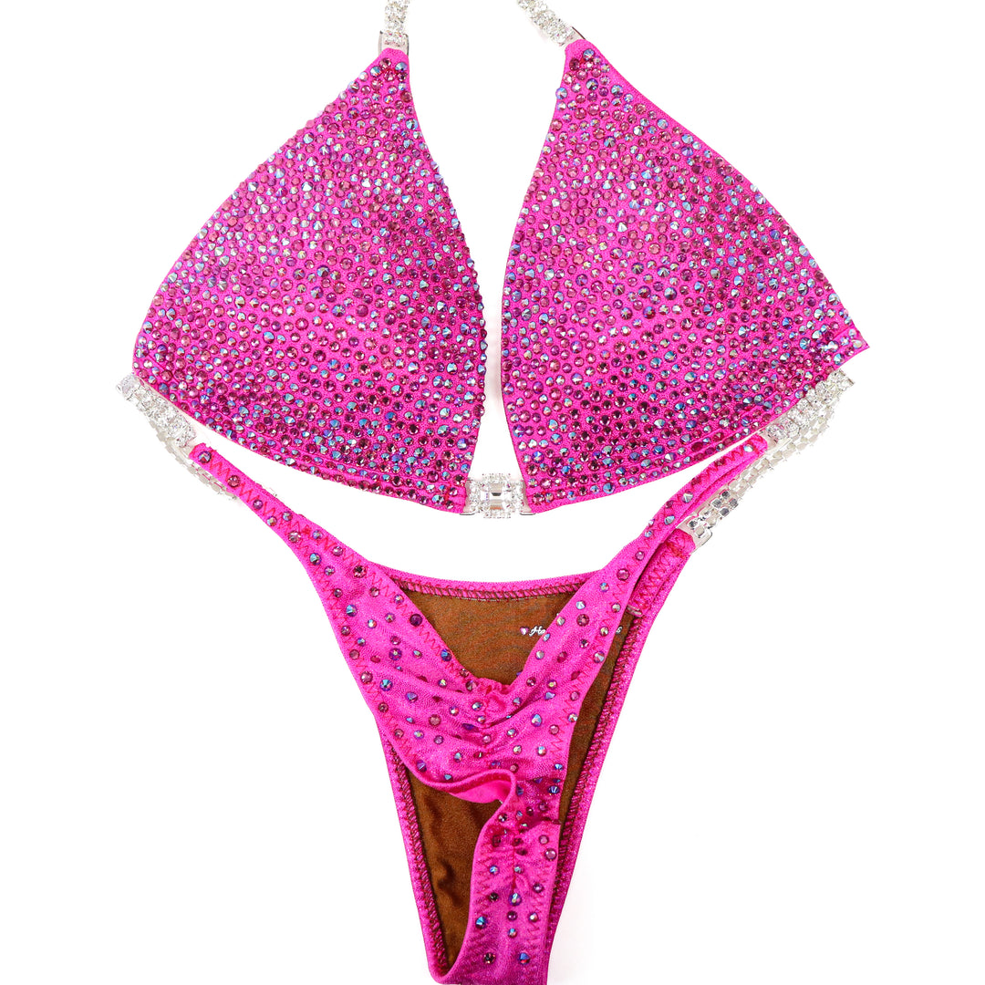 QS ST: Lucia's Pink Radiance. Hologram Pink. Medium Molded/Pro.  Angel Competition BikinisThe best NPC Competition Suits for the Bikini Division, Fit Model Division Suits, and bodybuilding suits.