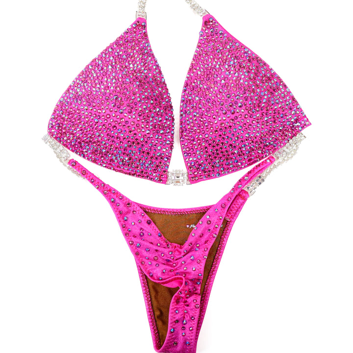 QS ST: Lucia's Pink Radiance. Hologram Pink. Medium Molded/Pro.  Angel Competition BikinisThe best NPC Competition Suits for the Bikini Division, Fit Model Division Suits, and bodybuilding suits.