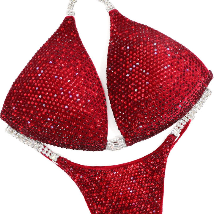 Red bikini set with sparkling details on a white background