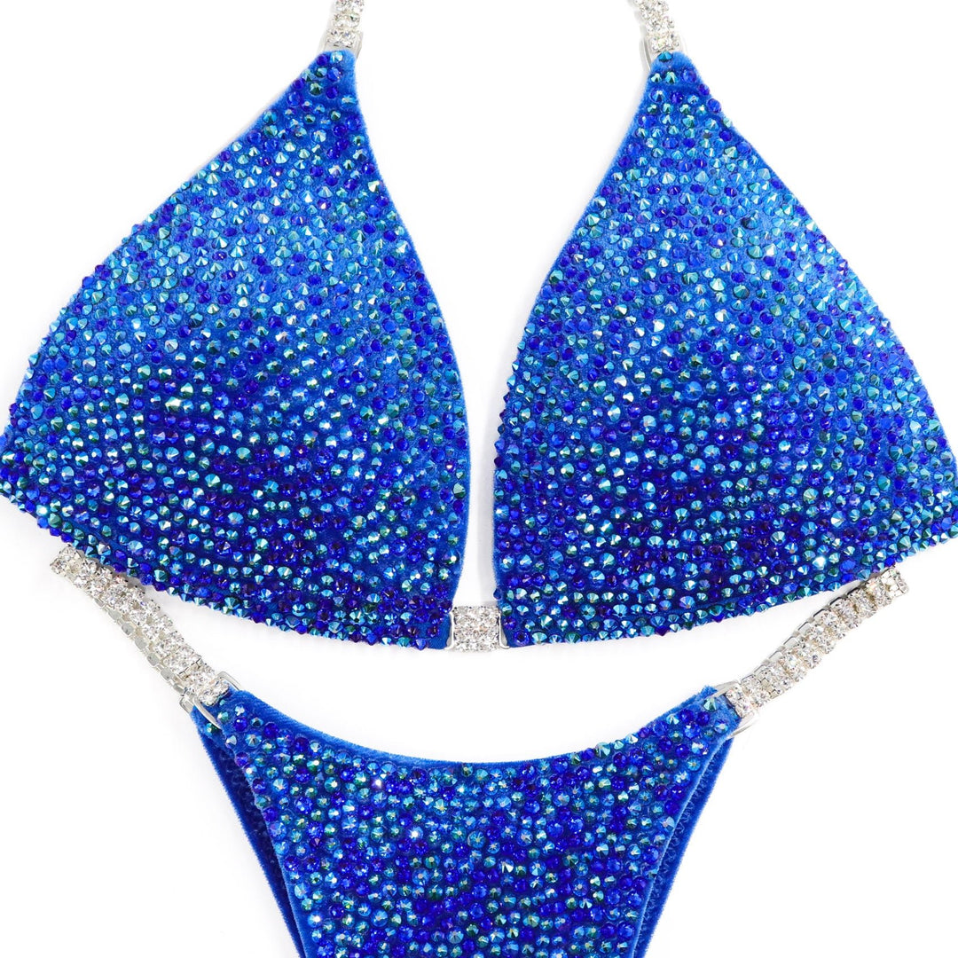 Deb's Breezy Blue Velvet Radiance bikini with sapphire and emerald AB crystals on blue velvet for competition suits