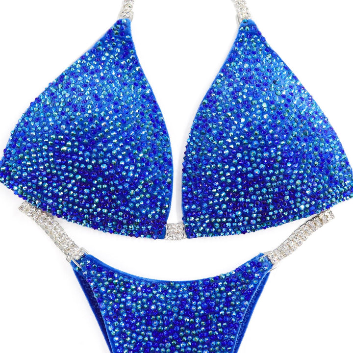 Deb's Breezy Blue Velvet Radiance bikini with sapphire and emerald AB crystals on blue velvet for competition suits