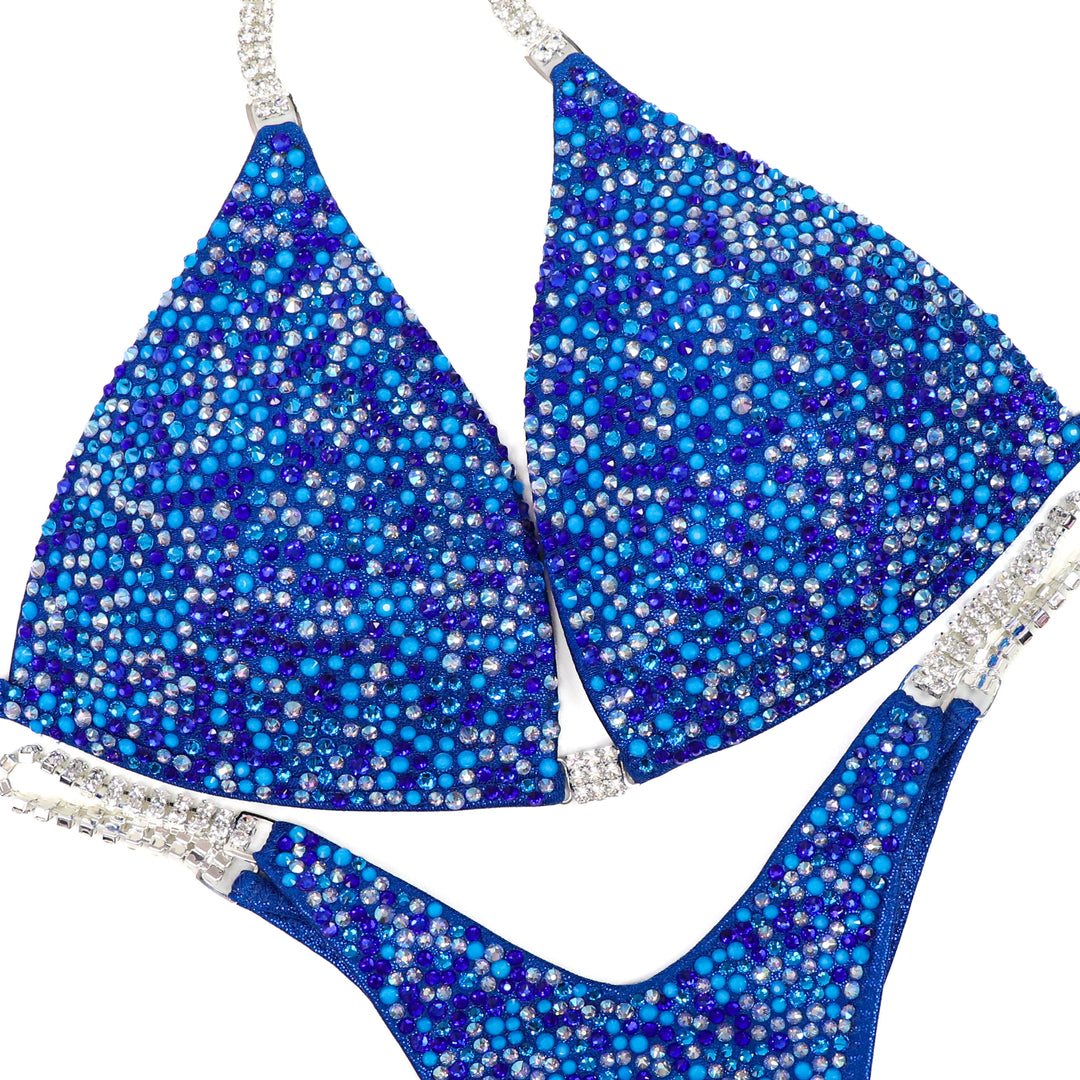 QS ST: Neon Blue Horizon Radiance. Medium Molded/Pro.  Angel Competition BikinisThe best NPC Competition Suits for the Bikini Division, Fit Model Division Suits, and bodybuilding suits.