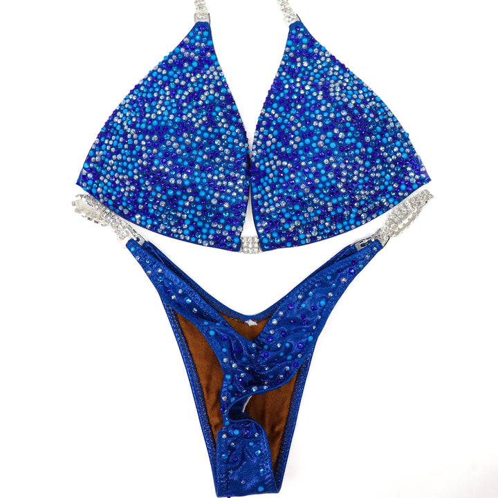 QS ST: Neon Blue Horizon Radiance. Medium Molded/Pro.  Angel Competition BikinisThe best NPC Competition Suits for the Bikini Division, Fit Model Division Suits, and bodybuilding suits.