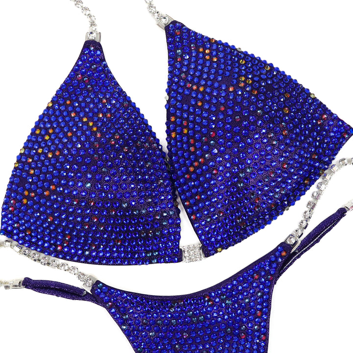 QS ST: Royal Radiant Pro. Hologram Eggplant. Medium Molded/Pro.  Angel Competition BikinisThe best NPC Competition Suits for the Bikini Division, Fit Model Division Suits, and bodybuilding suits.