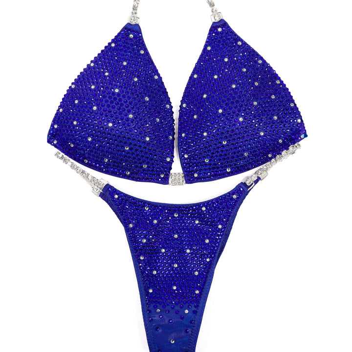QS ST: Electric Shine Shimmer. Hologram Electric Purple. Medium Molded/Pro.  Angel Competition BikinisThe best NPC Competition Suits for the Bikini Division, Fit Model Division Suits, and bodybuilding suits.