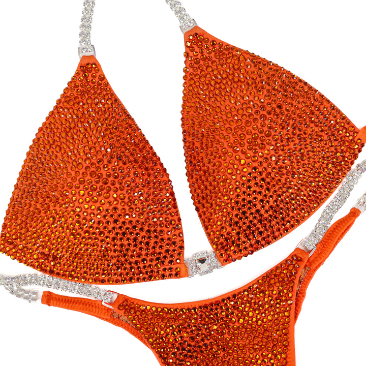 QS ST: Ember Radiance. Matte Orange. Medium Molded/Pro.  Angel Competition BikinisThe best NPC Competition Suits for the Bikini Division, Fit Model Division Suits, and bodybuilding suits.