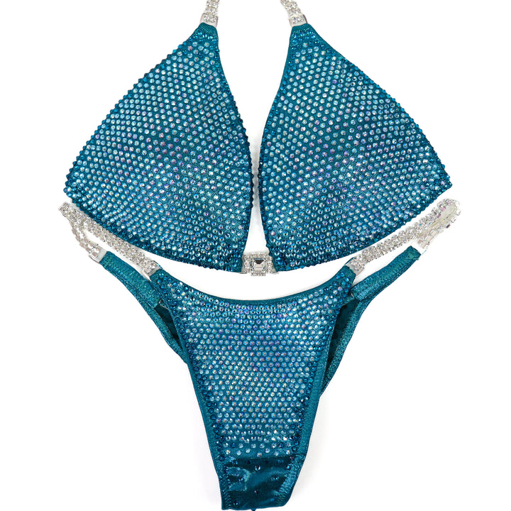 QS ST: Kassandra Gillis Teal Nova. Medium Molded/Pro.  Angel Competition BikinisThe best NPC Competition Suits for the Bikini Division, Fit Model Division Suits, and bodybuilding suits.
