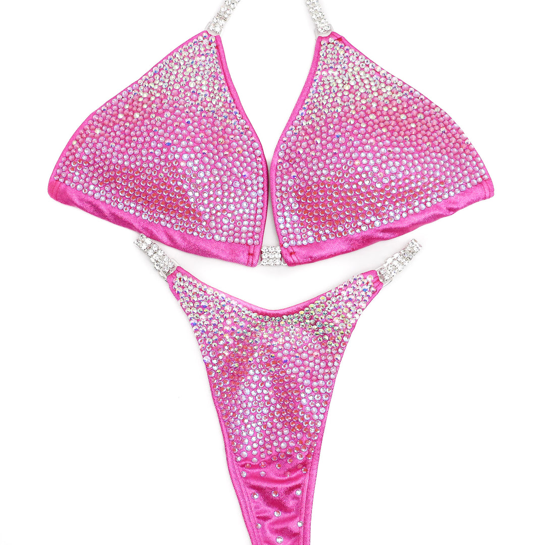 Introducing Pink Princess Gradient 👑! From crystal AB to lotus pink, this stunning suit shines with elegance and grace 💖. Embrace your inner queen on stage! #Bodybuilding #CompetitionSuit #PinkPrincessGradient 👙👑🌟