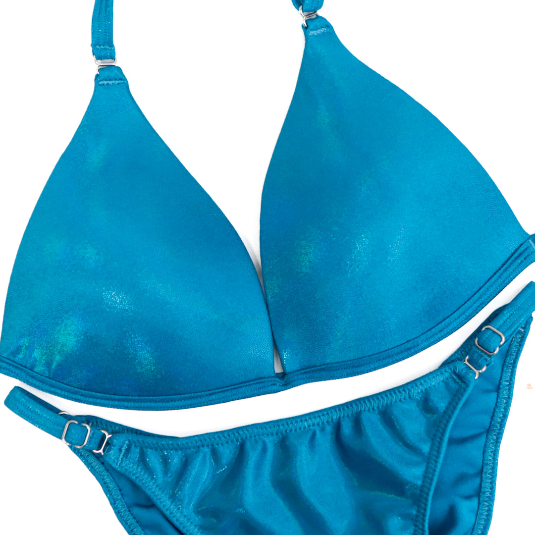 QS CL: Hologram Turquoise Fit Model Suit. Medium Molded/Fit Model 1 with Custom Rise.  Angel Competition BikinisThe best NPC Competition Suits for the Bikini Division, Fit Model Division Suits, and bodybuilding suits.