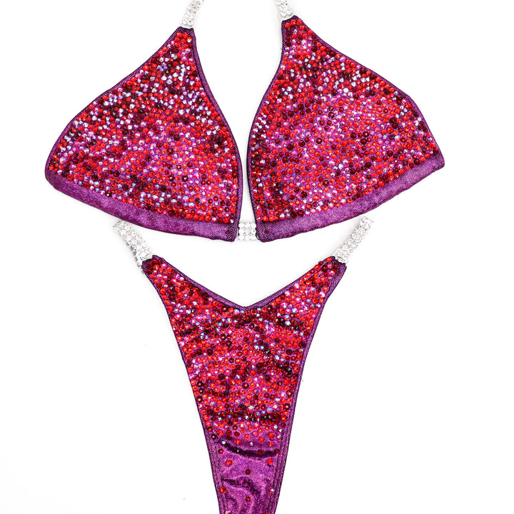 Introducing Ashley Kaltwasser's Cranberry Sauce Radiance! Designed for NPC Bikini or Wellness competitors, this suit features hologram cranberry, ensuring you stand out on stage with its vibrant red tones. Elevate your performance and presence with this captivating design.