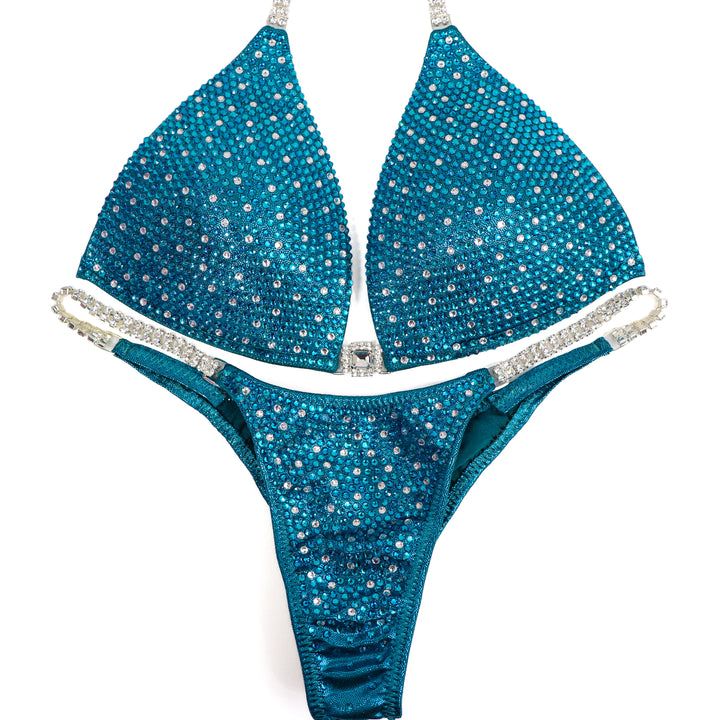 QS ST: Teal Angel Shimmer. Medium Molded/Pro.  Angel Competition BikinisThe best NPC Competition Suits for the Bikini Division, Fit Model Division Suits, and bodybuilding suits.