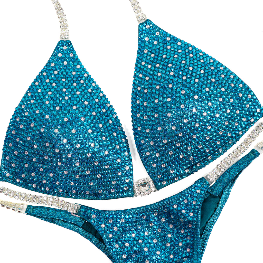 QS ST: Teal Angel Shimmer. Medium Molded/Pro.  Angel Competition BikinisThe best NPC Competition Suits for the Bikini Division, Fit Model Division Suits, and bodybuilding suits.