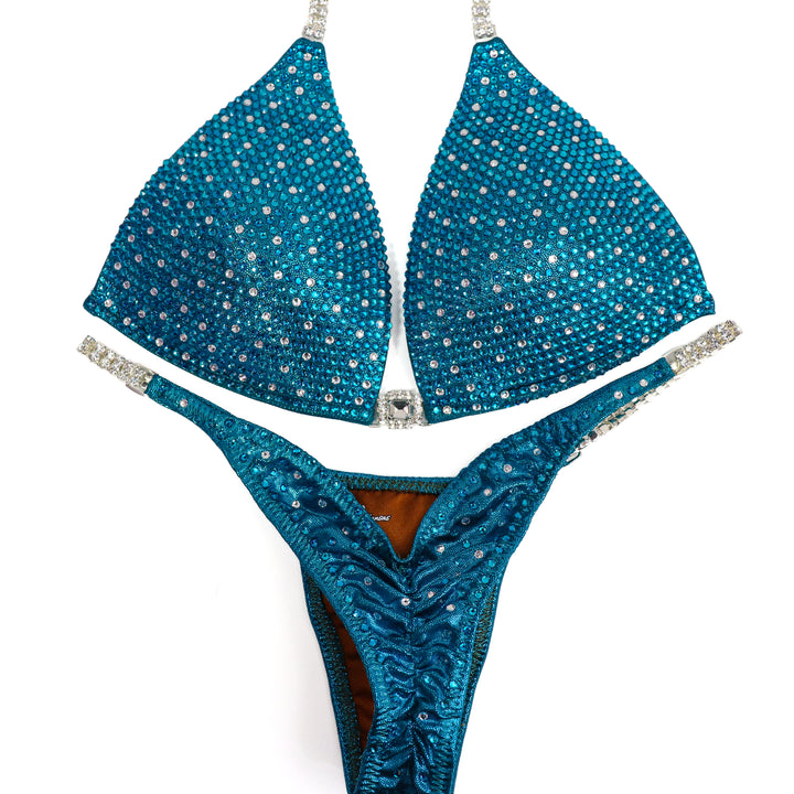 QS ST: Teal Angel Shimmer. Medium Molded/Pro.  Angel Competition BikinisThe best NPC Competition Suits for the Bikini Division, Fit Model Division Suits, and bodybuilding suits.