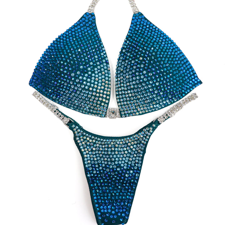QS ST: Capri Cascade Glow. Matte Teal. Medium Molded/Pro.  Angel Competition BikinisThe best NPC Competition Suits for the Bikini Division, Fit Model Division Suits, and bodybuilding suits.