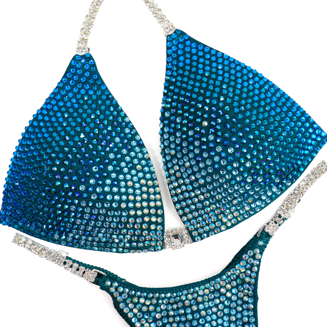 QS ST: Capri Cascade Glow. Matte Teal. Medium Molded/Pro.  Angel Competition BikinisThe best NPC Competition Suits for the Bikini Division, Fit Model Division Suits, and bodybuilding suits.