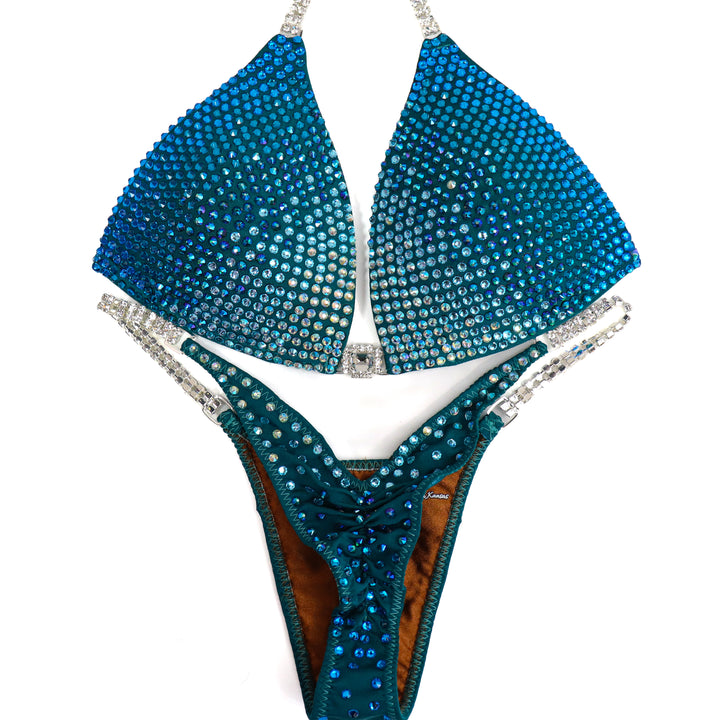 QS ST: Capri Cascade Glow. Matte Teal. Medium Molded/Pro.  Angel Competition BikinisThe best NPC Competition Suits for the Bikini Division, Fit Model Division Suits, and bodybuilding suits.