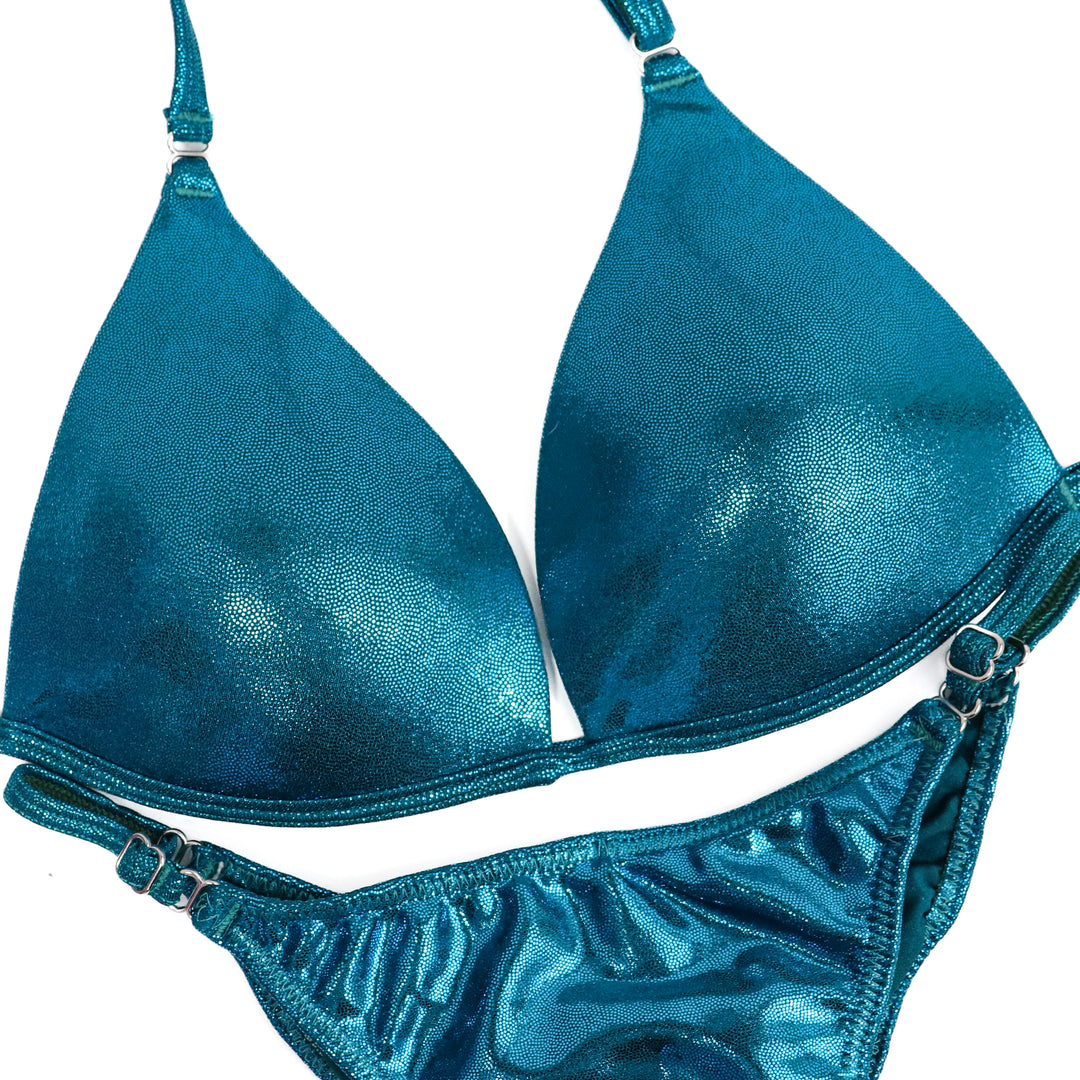 QS ST: Hologram Teal Posing Practice Suit. Small Molded/Fit Model 1.  Angel Competition BikinisThe best NPC Competition Suits for the Bikini Division, Fit Model Division Suits, and bodybuilding suits.