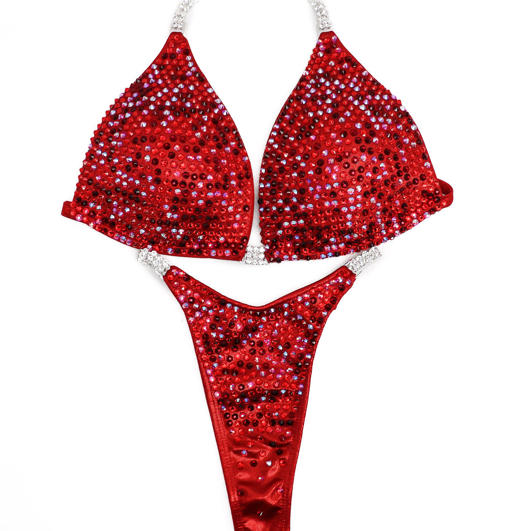 Elevate your stage presence with Angel Competition Bikinis' Hologram Red Competition Suits, including the stunning Hope's Flamin' Hot Multi Color design. Our bodybuilding bikinis are meticulously crafted for precision, featuring micro bikini competition suits for a sleek and dynamic look. The best bodybuilding suits!