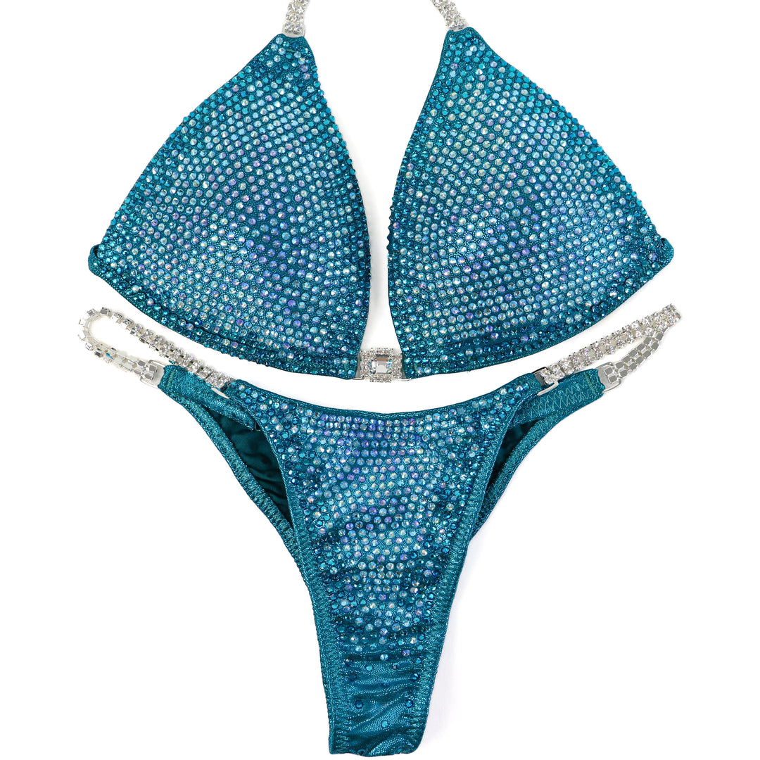 QS ST: Kassandra Gillis Teal Nova. Medium Molded/Pro.  Angel Competition BikinisThe best NPC Competition Suits for the Bikini Division, Fit Model Division Suits, and bodybuilding suits.