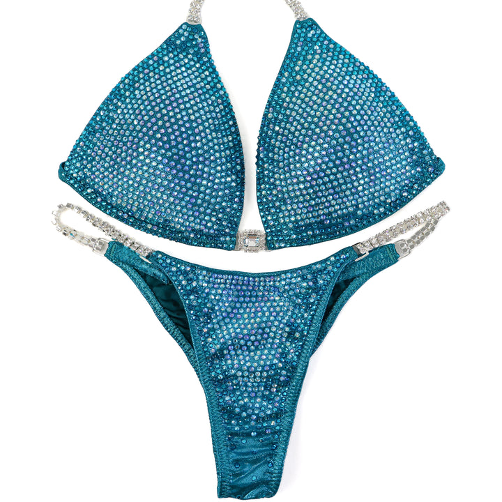 QS ST: Kassandra Gillis Teal Nova. Medium Molded/Pro.  Angel Competition BikinisThe best NPC Competition Suits for the Bikini Division, Fit Model Division Suits, and bodybuilding suits.