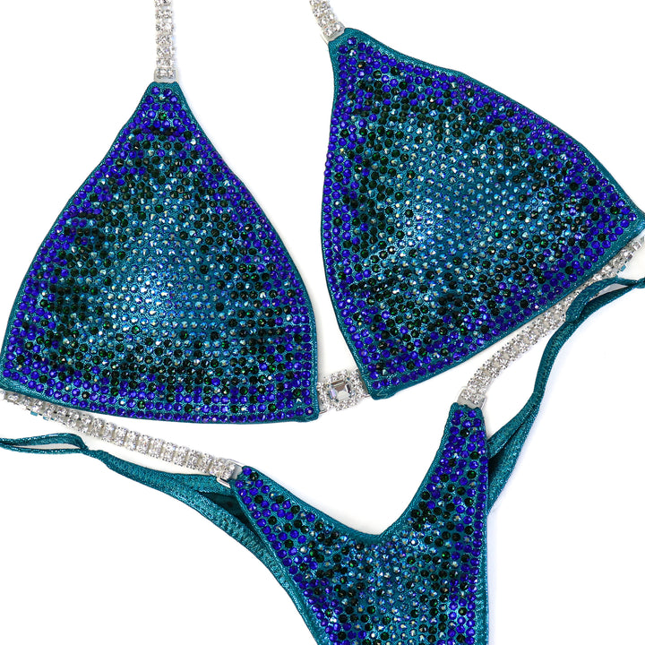 QS ST: Crystal Nova 3 Color. Hologram Teal. Medium/Pro.  Angel Competition BikinisThe best NPC Competition Suits for the Bikini Division, Fit Model Division Suits, and bodybuilding suits.