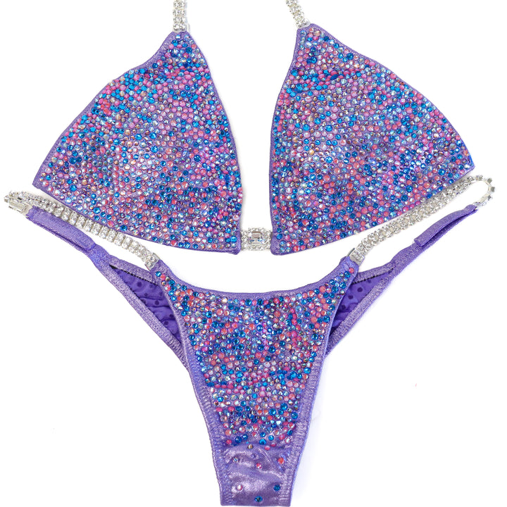 QS ST: Julia's Lilac Radiance. Hologram Lilac. Medium/Pro.  Angel Competition BikinisThe best NPC Competition Suits for the Bikini Division, Fit Model Division Suits, and bodybuilding suits.