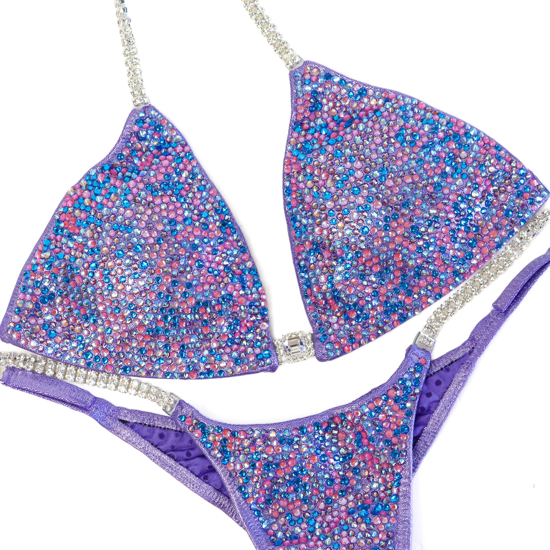 QS ST: Julia's Lilac Radiance. Hologram Lilac. Medium/Pro.  Angel Competition BikinisThe best NPC Competition Suits for the Bikini Division, Fit Model Division Suits, and bodybuilding suits.