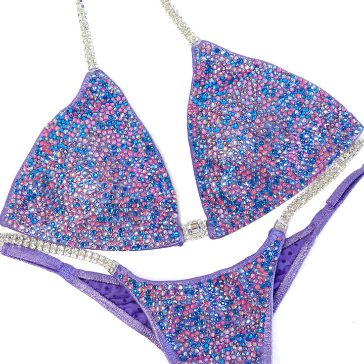 QS ST: Julia's Lilac Radiance. Hologram Lilac. Medium/Pro.  Angel Competition BikinisThe best NPC Competition Suits for the Bikini Division, Fit Model Division Suits, and bodybuilding suits.