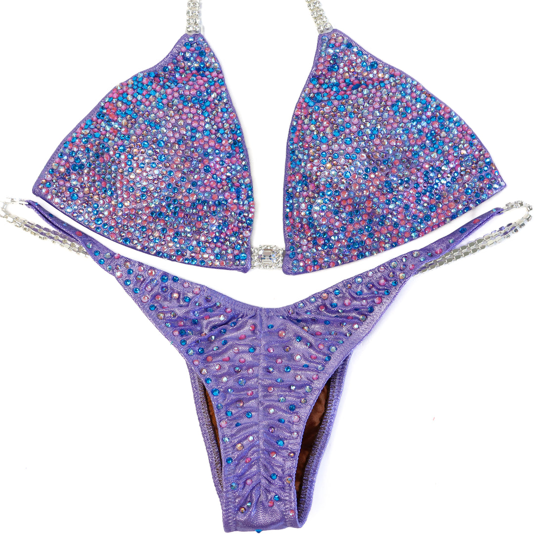 QS ST: Julia's Lilac Radiance. Hologram Lilac. Medium/Pro.  Angel Competition BikinisThe best NPC Competition Suits for the Bikini Division, Fit Model Division Suits, and bodybuilding suits.