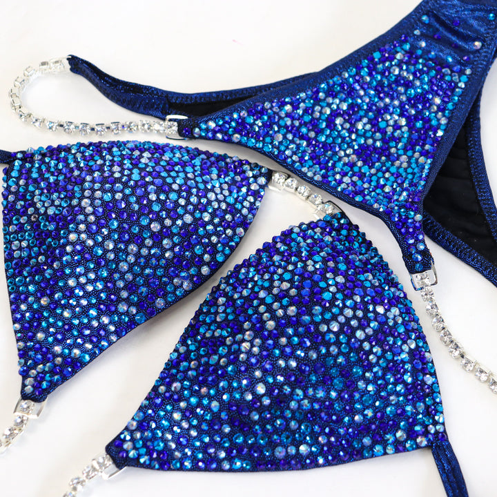 Dark Blueberry Radiance  Angel Competition BikinisThe best NPC Competition Suits for the Bikini Division, Fit Model Division Suits, and bodybuilding suits.