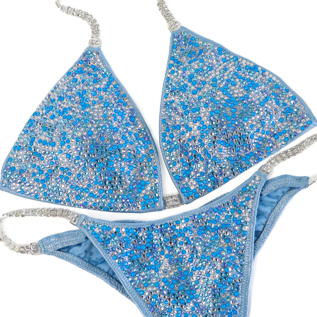 QS ST: Crystal Radiance. Hologram Baby Blue. Medium/Brazilian with Extra Modest Rise.  Angel Competition BikinisThe best NPC Competition Suits for the Bikini Division, Fit Model Division Suits, and bodybuilding suits.